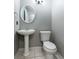 Classic bathroom with a pedestal sink and a modern toilet at 341 Kirkhill St, Ocoee, FL 34761