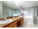 Spacious bathroom with a granite countertop vanity, separate shower, and soaking tub at 341 Kirkhill St, Ocoee, FL 34761