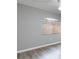 Comfortable bedroom with sleek wood-look floors and a large window at 341 Kirkhill St, Ocoee, FL 34761