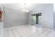 Bright dining room with tile flooring and sliding glass doors to the sunroom at 341 Kirkhill St, Ocoee, FL 34761