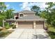 Charming home with a three-car garage and well-maintained landscaping at 341 Kirkhill St, Ocoee, FL 34761