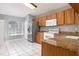 Kitchen with stainless steel appliances, granite countertops, and tile flooring at 341 Kirkhill St, Ocoee, FL 34761