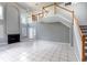 Spacious living room featuring high ceilings, a fireplace, and a staircase to the second floor at 341 Kirkhill St, Ocoee, FL 34761