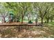 Community playground with mature trees, play equipment, swings, and bike racks at 341 Kirkhill St, Ocoee, FL 34761