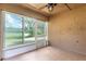 Bright screened porch with ceiling fan offers a relaxing outdoor living space at 341 Kirkhill St, Ocoee, FL 34761