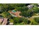 An aerial shot of the luxury estate, showcasing the pool, well-manicured lawn and beautiful tree coverage at 3412 Lilas Ct, Windermere, FL 34786