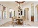 Cozy dining space with natural light, chandelier, and views to other rooms at 3412 Lilas Ct, Windermere, FL 34786