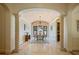 Formal dining room with decorative columns, archway, and elegant chandelier at 3412 Lilas Ct, Windermere, FL 34786