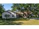 A bright daytime view of the home's exterior, showing landscaping, and architectural details at 3412 Lilas Ct, Windermere, FL 34786