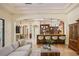 Spacious living area with breakfast bar, modern furniture, and seamless flow at 3412 Lilas Ct, Windermere, FL 34786