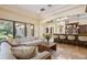 Bright living room features natural light, breakfast bar, and neutral decor at 3412 Lilas Ct, Windermere, FL 34786