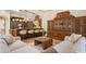 Open living area with wood cabinets, breakfast bar, and comfortable seating at 3412 Lilas Ct, Windermere, FL 34786