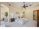 Inviting main bedroom with ample natural light, tray ceiling, and serene ambiance at 3412 Lilas Ct, Windermere, FL 34786