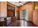 Office features custom built-ins, hardwood floors, and French doors leading to the outdoor patio at 3412 Lilas Ct, Windermere, FL 34786