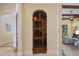 Ornate wrought iron gated wine cellar, showcasing the home's custom design and unique features at 3412 Lilas Ct, Windermere, FL 34786