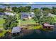 A gorgeous lakeside home featuring a screened-in pool, private boat dock, and fenced yard at 4301 Down Point Ln, Windermere, FL 34786