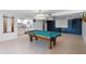 Spacious basement with a pool table, tile floors, and a wet bar and kitchenette at 4301 Down Point Ln, Windermere, FL 34786
