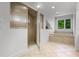 Bathroom with tiled shower, soaking tub, tile floors and a window providing natural light at 4301 Down Point Ln, Windermere, FL 34786