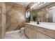 This bathroom features uniquely textured walls, a dual-sink vanity, and great lighting at 4301 Down Point Ln, Windermere, FL 34786