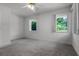 Bedroom featuring natural light from two windows, complemented by neutral tones at 4301 Down Point Ln, Windermere, FL 34786