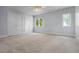 A bright bedroom featuring a ceiling fan and large windows with a closet at 4301 Down Point Ln, Windermere, FL 34786