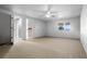 A well-lit bedroom boasts neutral carpet, a ceiling fan, and natural light from the window at 4301 Down Point Ln, Windermere, FL 34786