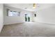 Bright, spacious bedroom with a ceiling fan and access to a balcony at 4301 Down Point Ln, Windermere, FL 34786
