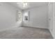 Bedroom with two windows offering natural light, neutral walls, and carpet flooring at 4301 Down Point Ln, Windermere, FL 34786