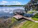 Scenic lake view featuring a private dock with boat lift and covered boat slip at 4301 Down Point Ln, Windermere, FL 34786