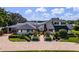 Charming two-story home with beautiful landscaping, an inviting circular driveway, and stunning front entry at 4301 Down Point Ln, Windermere, FL 34786