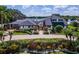 Charming two-story home with beautiful landscaping, an inviting circular driveway, and a waterside view at 4301 Down Point Ln, Windermere, FL 34786