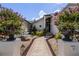 Charming front entrance with manicured landscaping, flowering planters, and a brick pathway at 4301 Down Point Ln, Windermere, FL 34786