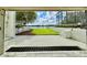 Garage showcasing an amazing backyard view of a lush lawn leading to a serene lake at 4301 Down Point Ln, Windermere, FL 34786