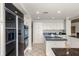 Kitchen with granite countertops, modern appliances, and ample storage space at 4301 Down Point Ln, Windermere, FL 34786
