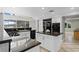Spacious kitchen featuring granite countertops, island, modern appliances, and water views at 4301 Down Point Ln, Windermere, FL 34786