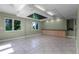 A spacious living room with tile flooring, green walls and lots of natural light at 4301 Down Point Ln, Windermere, FL 34786