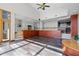 Bright open floor plan living room with wood floors and natural lighting at 4301 Down Point Ln, Windermere, FL 34786