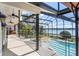 Expansive patio area offers panoramic lake views, seamlessly blending indoor and outdoor living spaces at 4301 Down Point Ln, Windermere, FL 34786