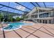 Large pool area with surrounding patio enclosed by a screen featuring an exterior staircase at 4301 Down Point Ln, Windermere, FL 34786