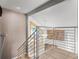 Modern staircase with metal railings at 4301 Down Point Ln, Windermere, FL 34786