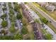 Sprawling townhome community with multiple parking lots, mature landscaping and a road nearby at 5060 Downing St # 6, Orlando, FL 32839