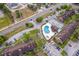 Aerial view of townhome community with ample parking and community pool at 5060 Downing St # 6, Orlando, FL 32839
