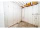 Unfinished basement showing utility pipes and concrete walls at 5060 Downing St # 6, Orlando, FL 32839