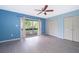Bedroom with ensuite deck, ceiling fan and double closet at 5060 Downing St # 6, Orlando, FL 32839