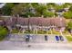 Charming townhome exterior with private patios, mature trees, and convenient parking at 5060 Downing St # 6, Orlando, FL 32839