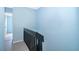 Second story hallway with view of stairs and light blue walls at 5060 Downing St # 6, Orlando, FL 32839
