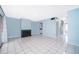 Living room with tile flooring and fireplace features an open layout at 5060 Downing St # 6, Orlando, FL 32839