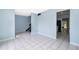 Open-concept space with gray stairs and ceramic tile flooring at 5060 Downing St # 6, Orlando, FL 32839