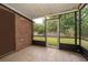 View of enclosed porch with brick wall overlooking backyard at 5060 Downing St # 6, Orlando, FL 32839