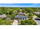 A single story home sits on a well-maintained lot landscaped with mature trees at 532 Darcey Dr, Winter Park, FL 32792